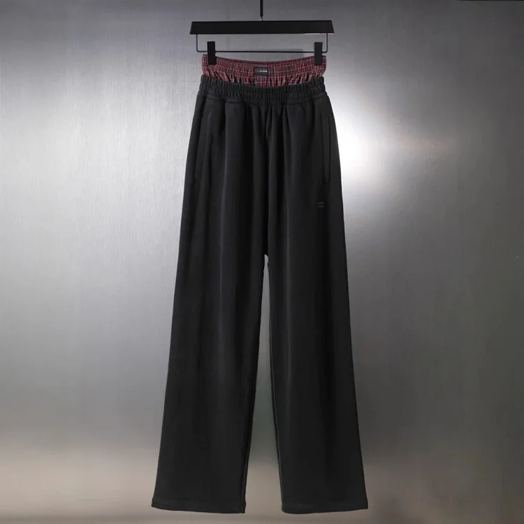 Balenciaga Checkered button-trimmed faux two-piece embroidered trousers